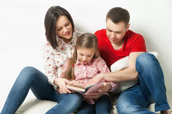 depositphotos_70575405-stock-photo-happy-family-parents-reading-book